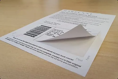 Custom printed integrated form with peel-off label attached to sheet.
