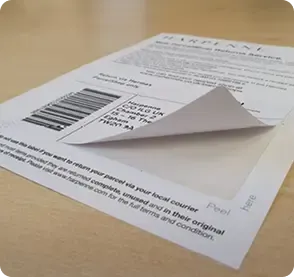 Custom printed integrated form with peel-off label attached to sheet.