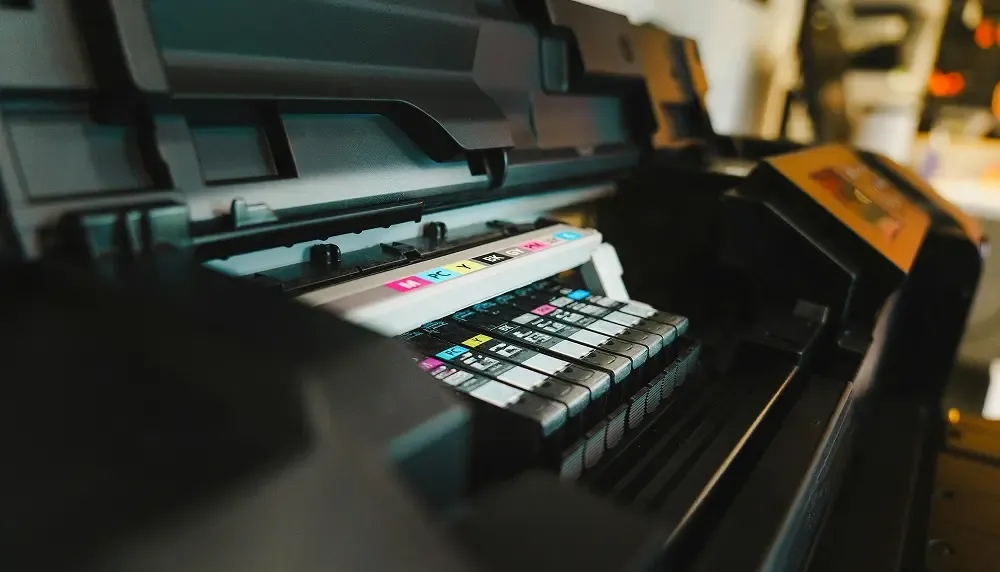 Detailed look of a high-quality printer with colorful ink cartridges.